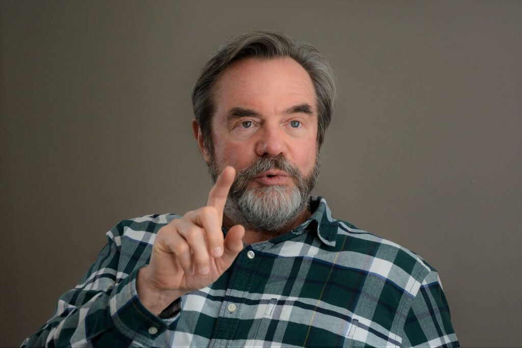 Picture Of A Man Tellinged Something