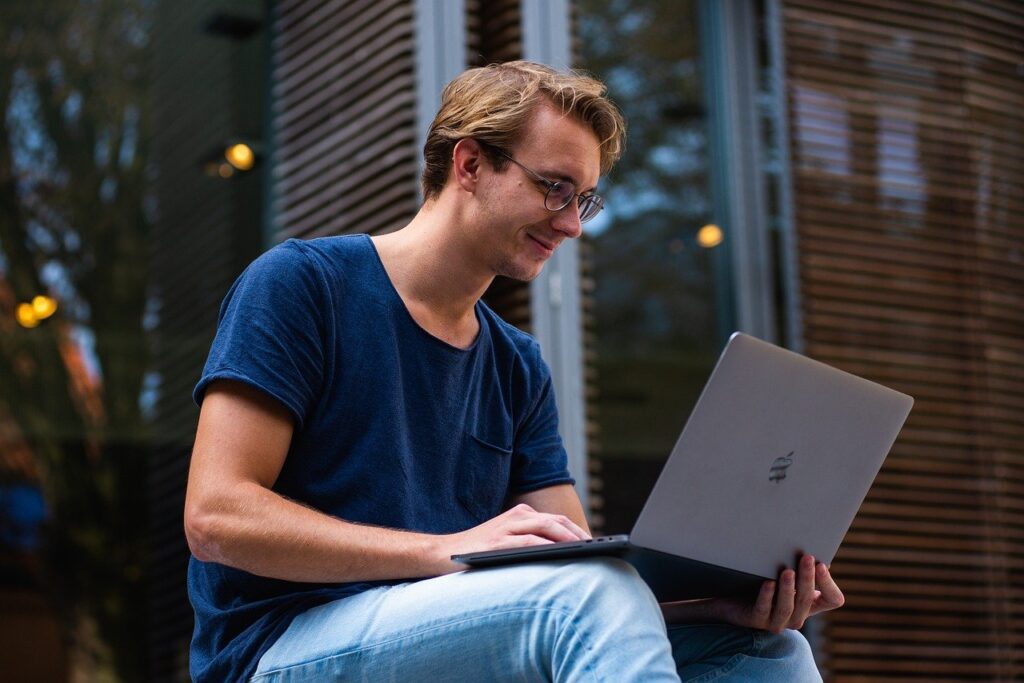 A man studying from his Laptop